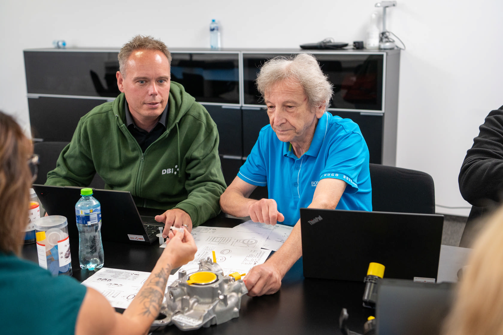 DBI Plastics engineers collaborating with clients on technical solutions.